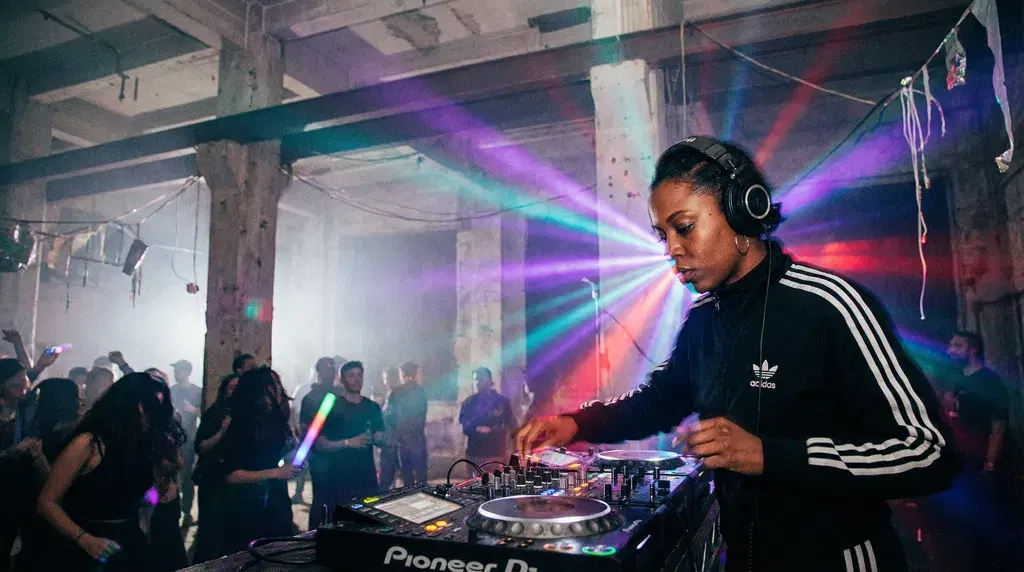 DJ performing at a warehouse rave